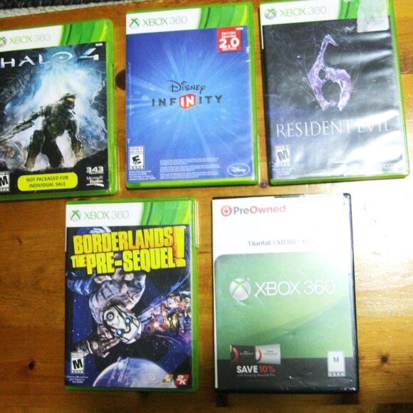 The product is a bundle containing five Xbox 360 games, including Resident Evil - Picture 1 of 12